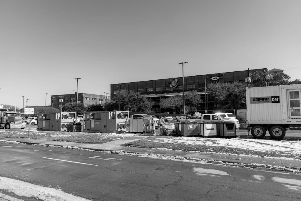 A shopping center in Waco, Texas covered in snow and ice. Target Solutions recovery team and equipment in parking lot.