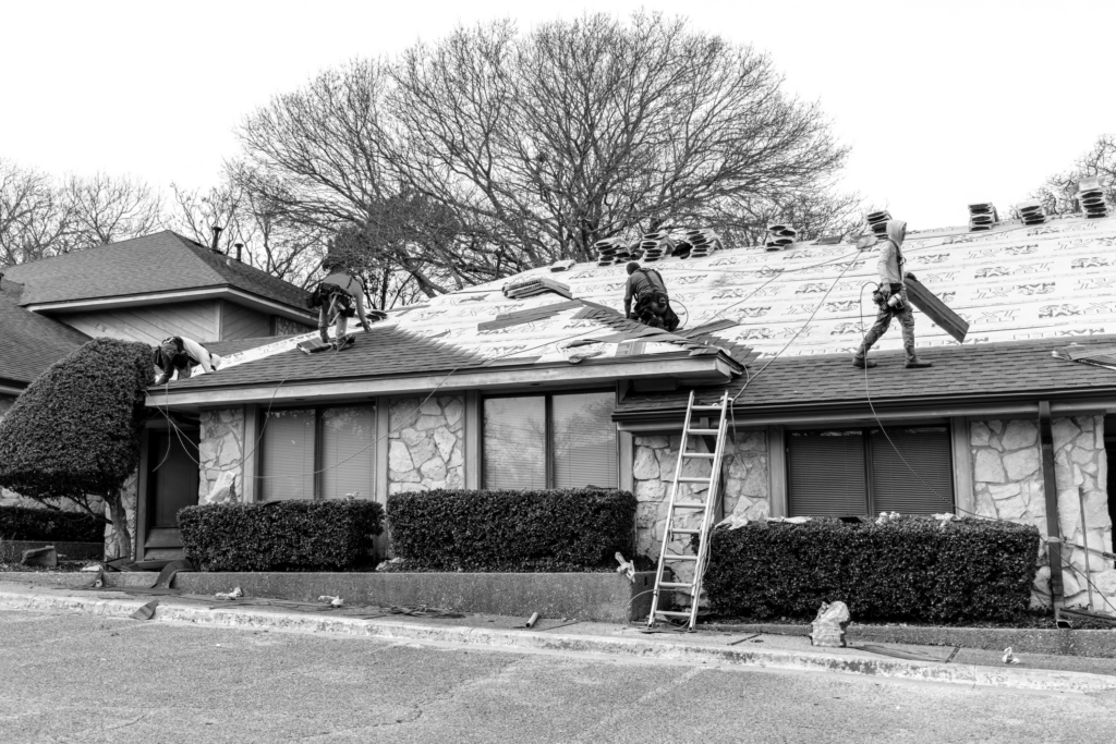 Workers repairing a roof