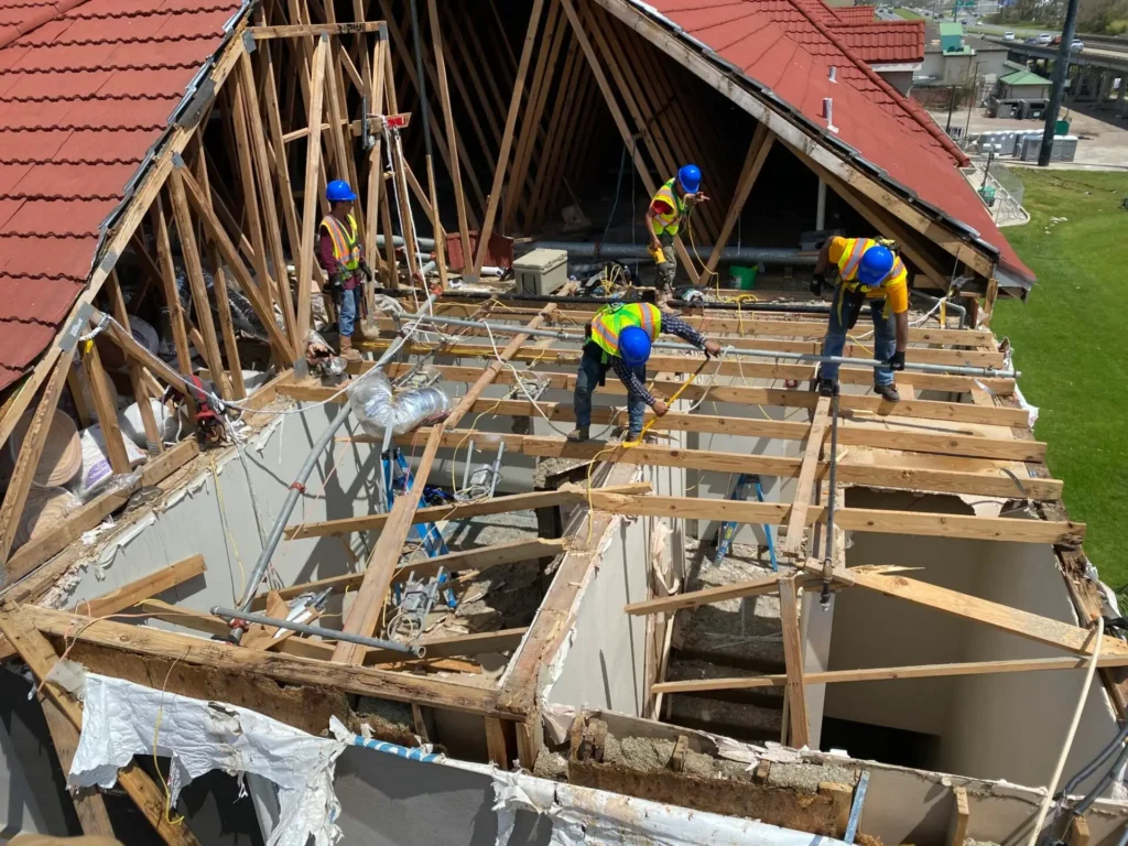 workers fixing a roof