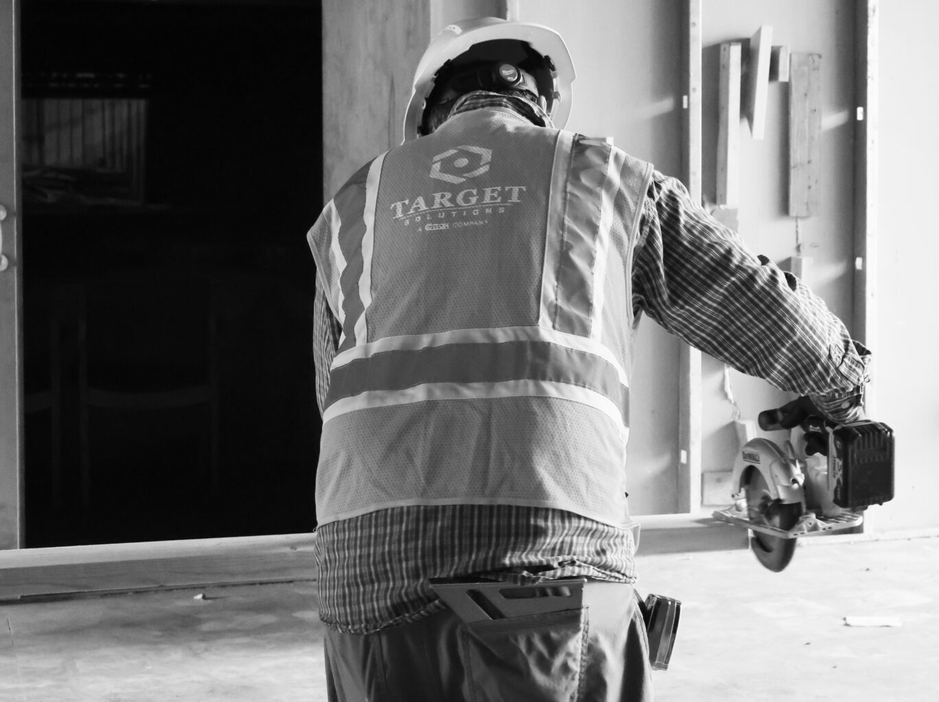 Carpenter cutting framing to size